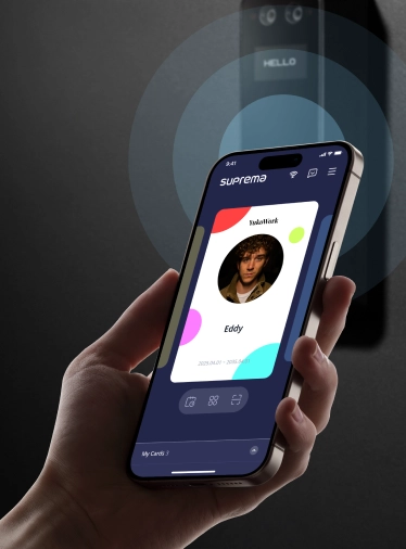 User tapping smartphone for mobile access on Suprema BioStar Air BioStation 3 reader with screen display
