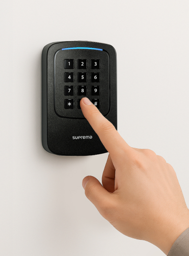User entering access code on Suprema Xpass 2 Gangbox keypad for secure door entry